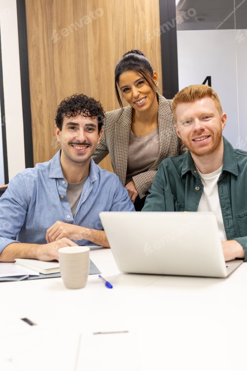 Preview: Diverse business team collaborating in modern office meeting