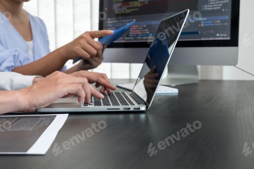 Preview: Team of programmers working with computer programming, professional development, and coding technolo