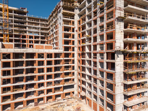Preview: Construction site of a high-rise building at sunny day. The structure's concrete framework, cranes