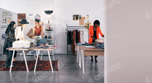 Preview: A day in the industry. Shot of a group of designers collaborating at a workshop together.