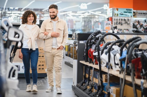 Preview: Couple exploring home appliance options in store
