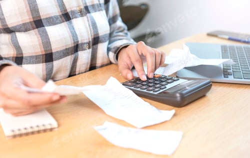 Preview: Business woman pressing the calculator calculate the various costs