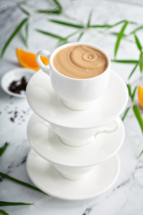 Preview: Earl grey milk tea poured in stacked cups