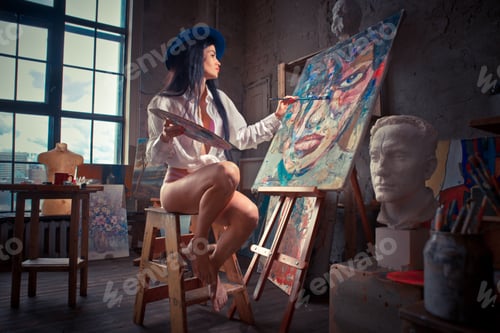 Preview: Young woman painter in her studio make some art