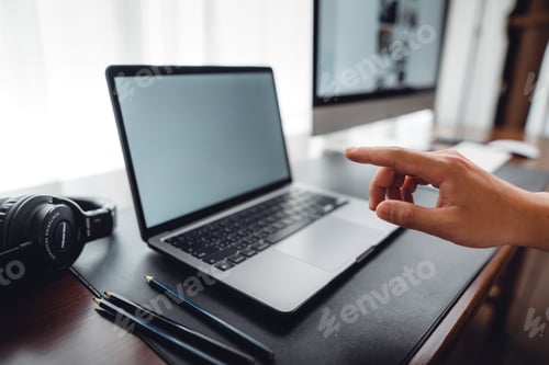 Preview: hands working on a laptop computer