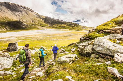 Preview: Group of hikers wandering through a stunning mountain valley.