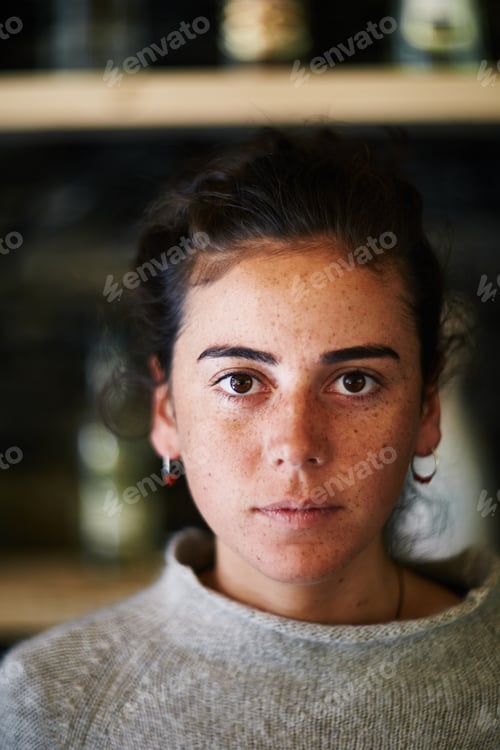 Preview: Portrait of Young Adult Caucasian Woman Staring Seriously into Camera