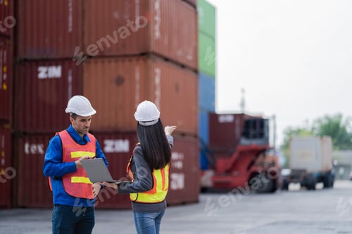 Preview: workers in high visibility safety gear and hard hats discuss operations