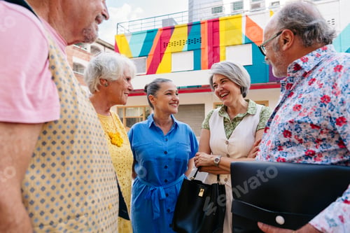 Preview: Group of senior friends meeting outddors in the city and having fun