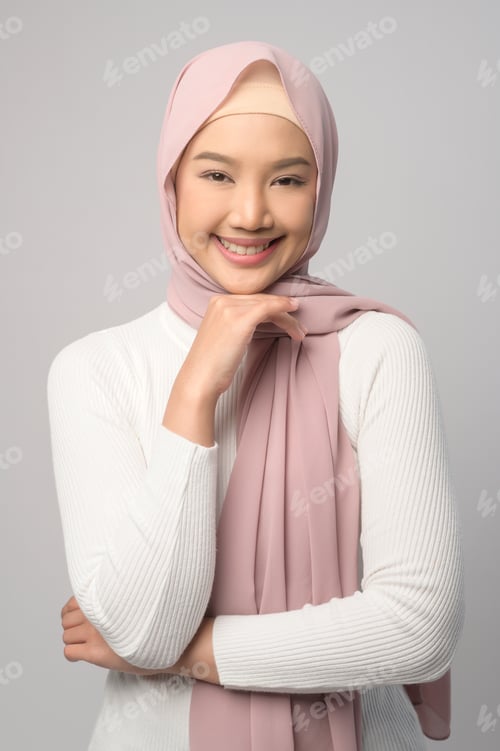 Preview: Muslim woman with hijab over white background studio.