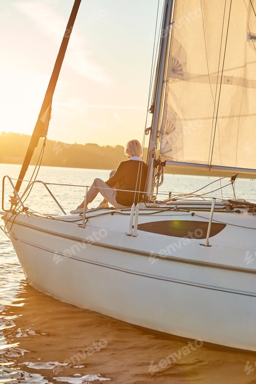 Preview: Time for yourself. View of the sail boat or yacht floating in sea with relaxed