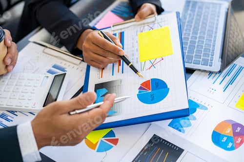 Preview: Business Professionals Analyzing Data and Graphs in Workplace