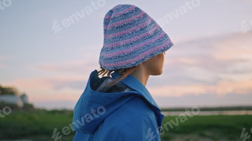 Preview: Portrait traveler enjoying evening riverside. Calm relaxed woman resting sunset