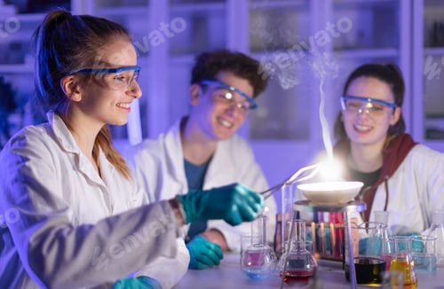 Preview: Excited science students doing chemical experiment in the laboratory at university.