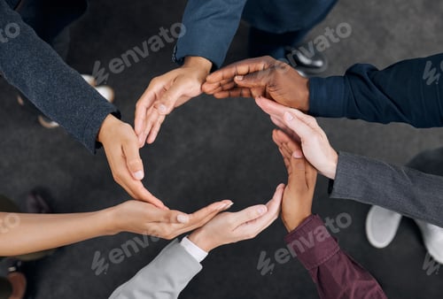 Preview: Shot of a group of businesspeople with their hands joined together to form a circle
