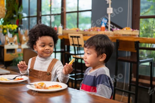 Preview: Boys enjoy eating snack together