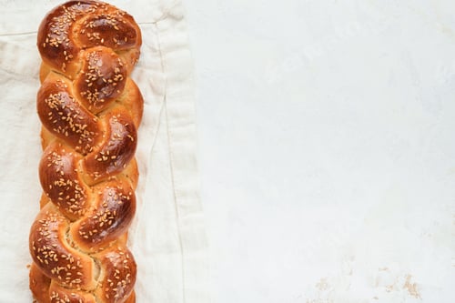 Preview: Сhallah bread. Sabbath kiddush ceremony composition. Freshly baked homemade braided challah bread fo