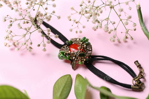 Preview: Beautiful bracelet with cornelian gemstone and flowers on pink background