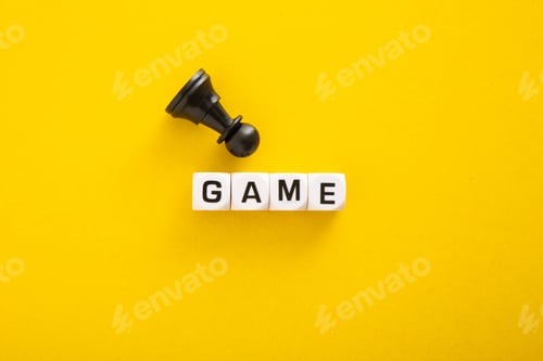 Preview: Fallen pawn near the word game on yellow background symbolizing business strategy