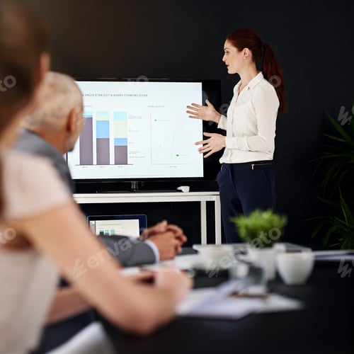 Preview: Cropped shot of a young businesswoman delivering a presentation in a boardroom