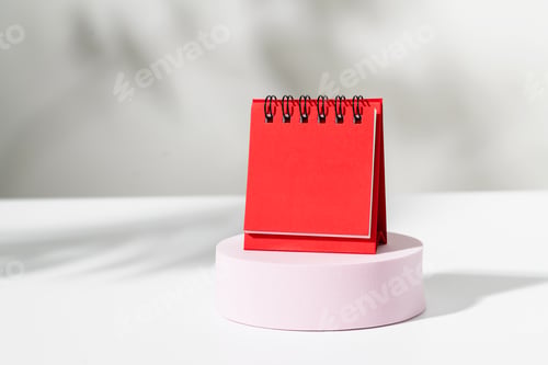 Preview: Close up of red blank calendar on podium, Template for place your design.