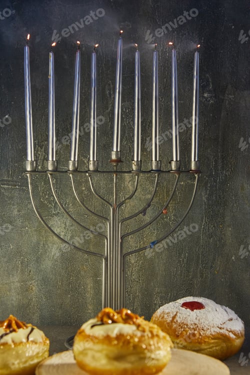 Preview: Jewish holiday Hanukkah background with menorah - traditional candelabra with candles and donuts