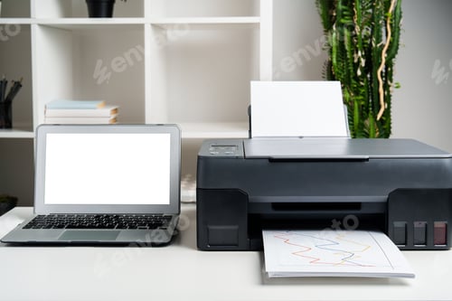 Preview: New modern printer and laptop in the office on table