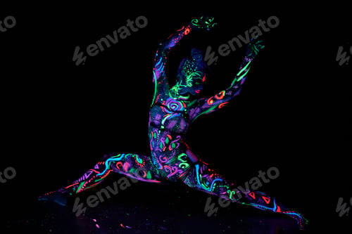 Preview: Art woman body art on the body dancing in ultraviolet light. Bright woman body neon color
