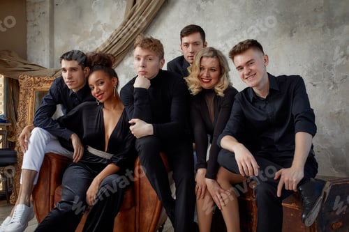 Preview: Portrait of diverse group of young people musical band playing with instruments - on gray concrete