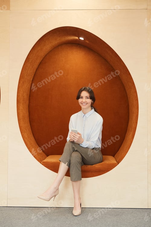 Preview: Young Aspiring Businesswoman Posing in Company Office