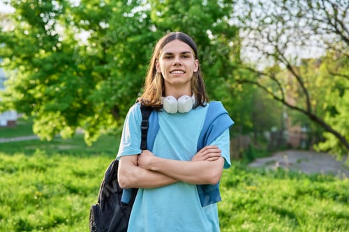 Preview: Teen in Park with Backpack and Headphones