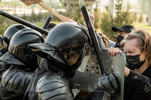Preview: Riot police with side handles stopping protestors