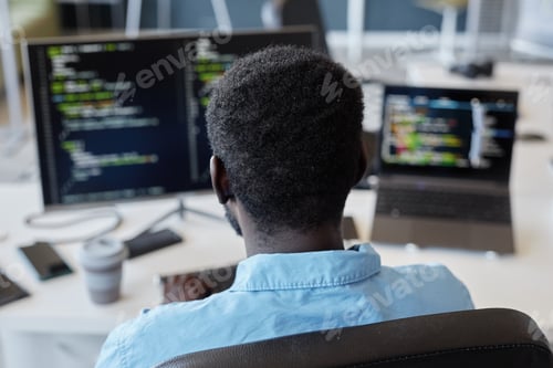 Preview: Software Developer Coding at Modern Workspace