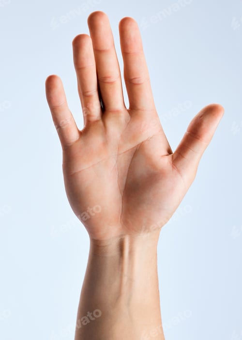 Preview: I surrender. Shot of an unrecognizable man showing his palm against a white background.