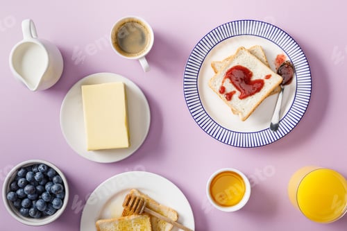 Preview: top view of served breakfast on violet background