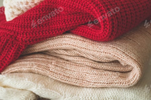 Preview: Folded Knitted Sweaters of Various Colors Close Up