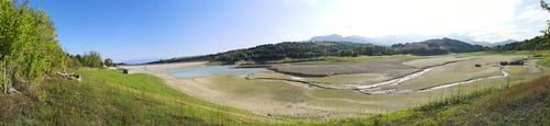Preview: Panoramic view of a landscape view with a dried-up dam and dense trees in Penne, Abruzzo in Italy