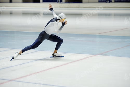 Preview: Side view of young active man having speed skating training