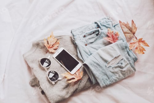 Preview: Autumn fashion clothes with smartphone and sunglasses