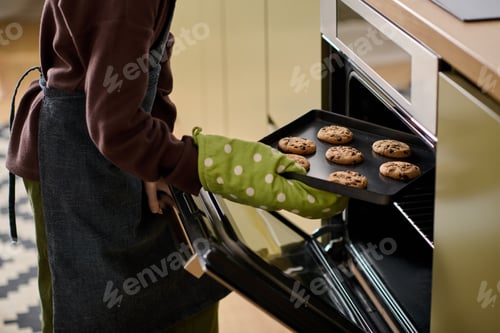 Preview: Little boy baking cookies and creating sweet memories in a cozy kitchen setting