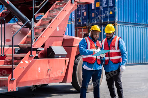 Preview: Two male engineers in a container shipping company