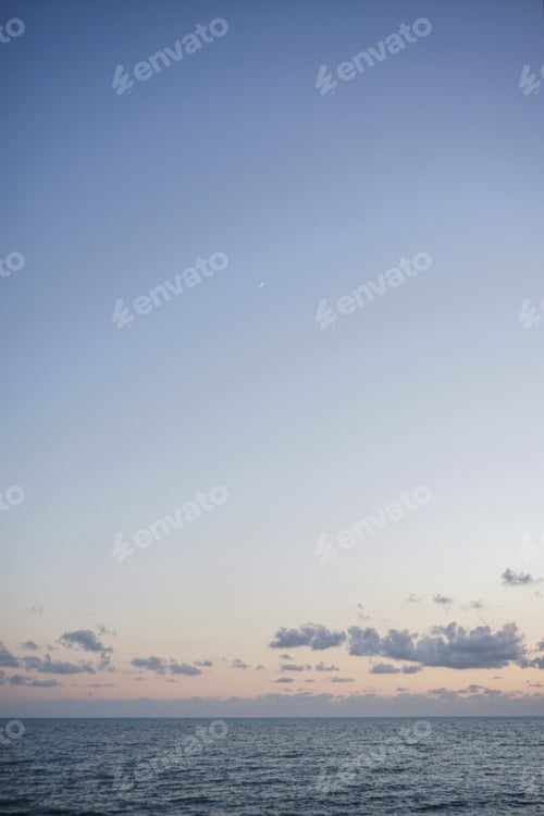 Preview: Beautiful seascape with clouds in the sky at sunset