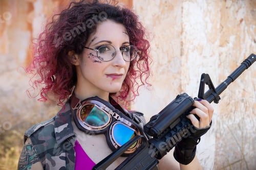 Preview: Young girl with pink hair and glasses holding a gun