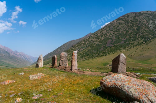 Preview: Balbal stone monuments in a green mountain valley