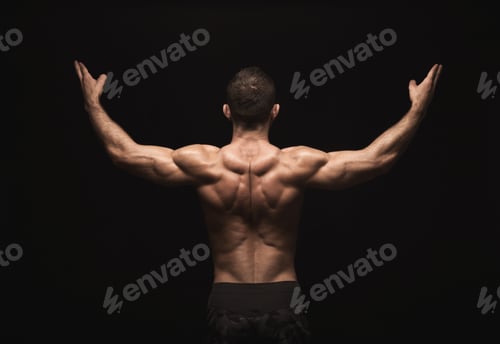 Preview: Unrecognizable man shows strong back muscles closeup