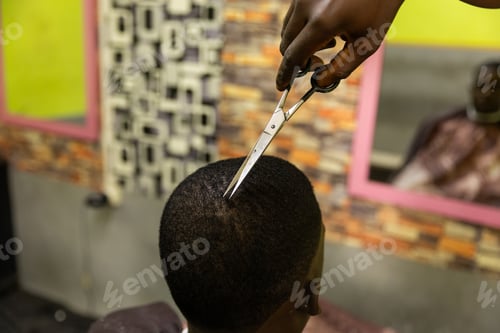 Preview: Close-up of scissors used by a barber to cut his client's hair