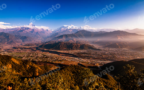 Preview: Scenic Mountain Vista over Valley Cityscape