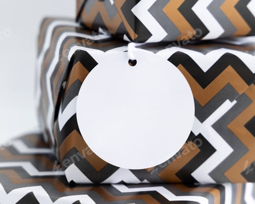 Preview: Presents Wrapped in chevron paper with blank gift tag close up, label Mockup