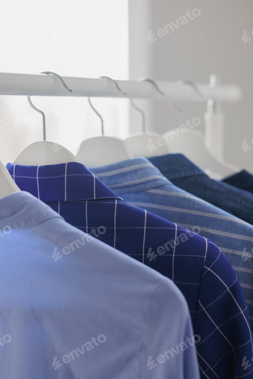Preview: Clean Shirts on Hangers in Bright Natural Light