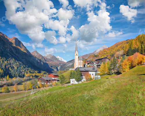 Preview: Amazing autumn landscape at Heiligenblut with St Vincent Church near Grossglockner mount .